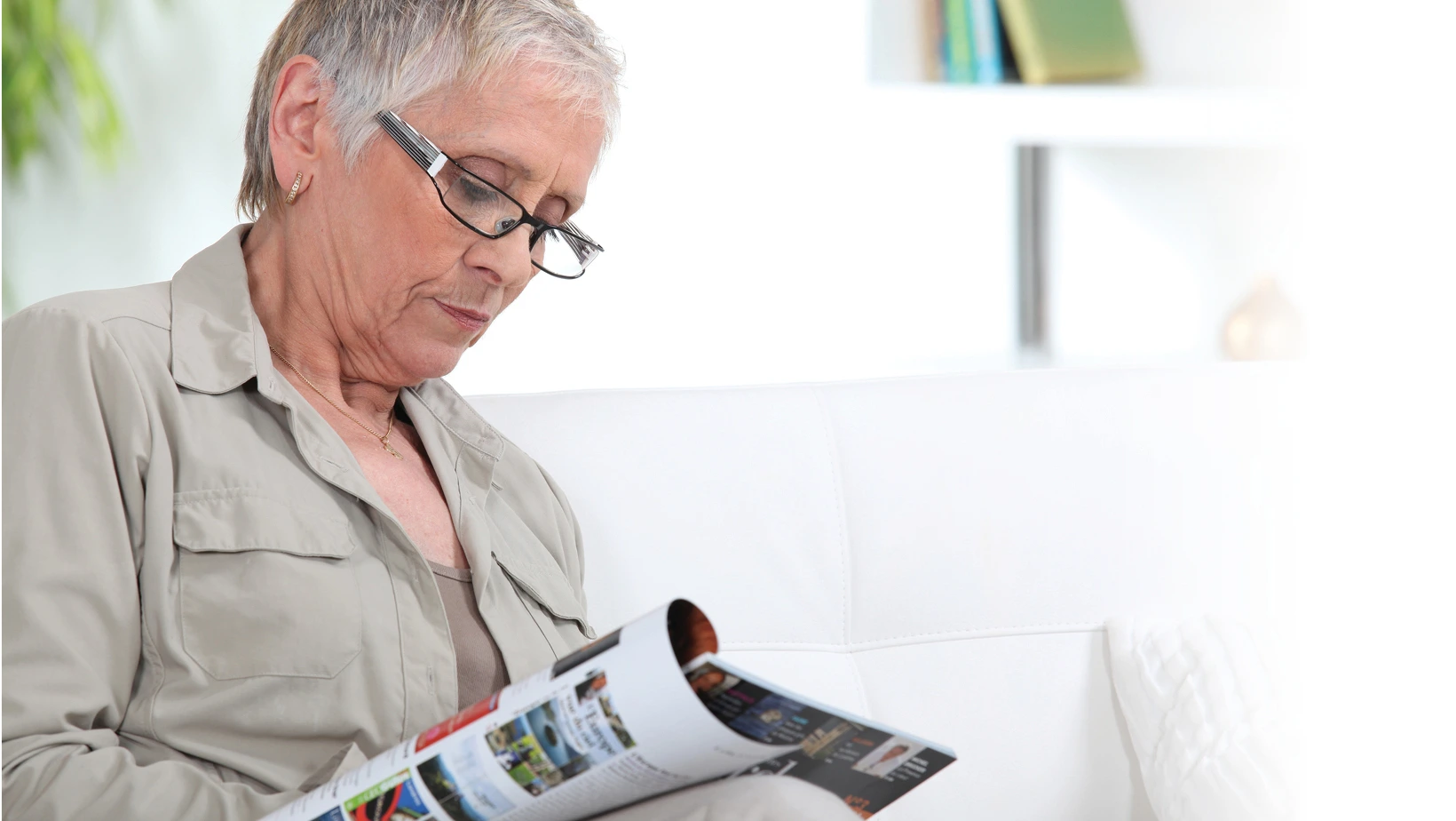 Woman reading magazine